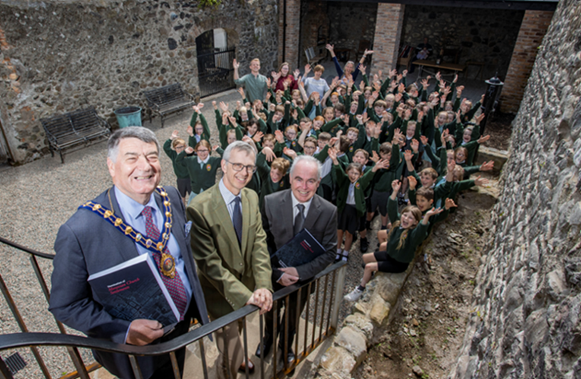 Cllr Noel Williams, Mayor of Mid and East Antrim Mayor joins school pupils to celebrate the restoration of the Old School. (2022)